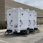 image shows a luxury portable restroom trailer, also known as a mobile toilet trailer or restroom trailer