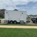 image shows a luxury portable restroom trailer, likely used for events or temporary needs